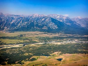 Snake River and the Teton range seen from plane just after take-off